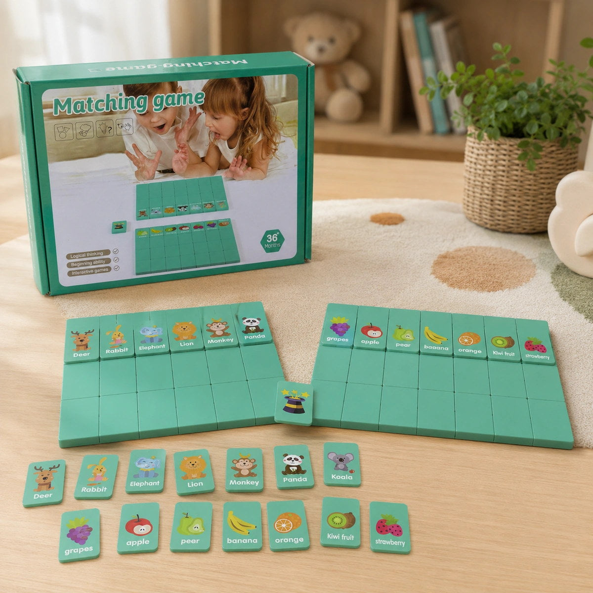 Jeu d'association : deux plateaux verts avec les tuiles fruits et animaux disposées devant