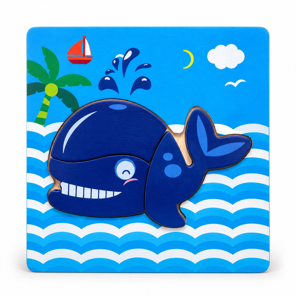 Puzzle en bois à encastrer La Baleine sur décor de mer avec palmier, voilier et jet d'eau