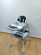 Chaise haute 3 en 1 UniCaré noire motif Reach for the Stars, châssis gris et tablette à porte-gobelet