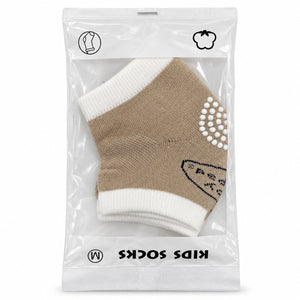 Chaussettes enfant beige et écru en sachet, picots antidérapants blancs sous le pied, taille M