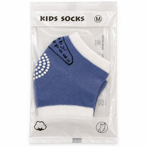 Chaussettes enfant bleues et écru en sachet, picots antidérapants blancs sous le pied, taille M