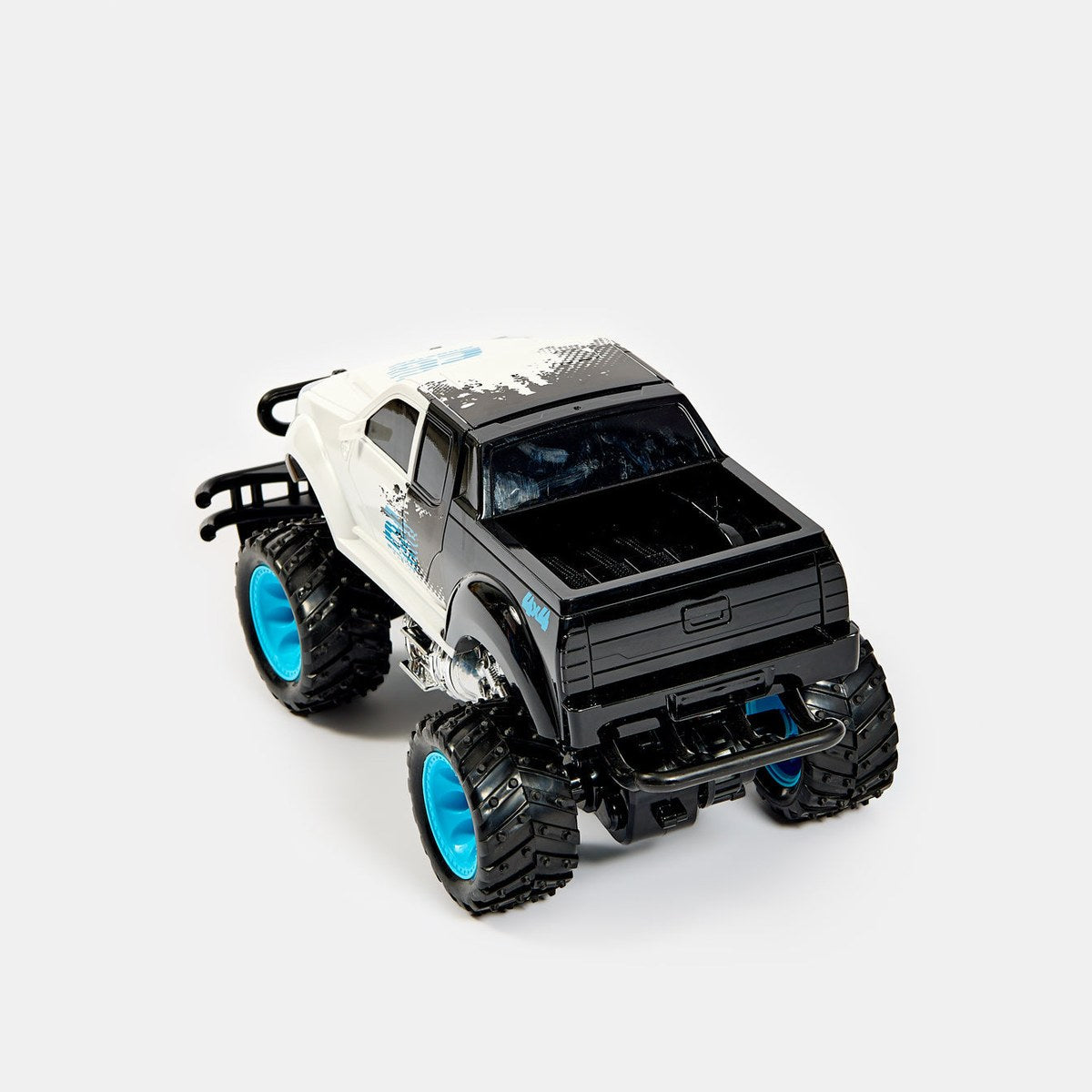 Monster truck RC blanc vu de trois quarts arrière avec benne noire