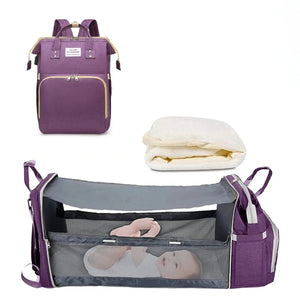 Sac à langer 3 en 1 coloris violet avec son lit d'appoint déplié