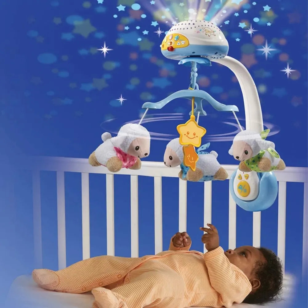 Mobile Compte-moutons VTech fixé au lit à barreaux au-dessus d'un bébé endormi